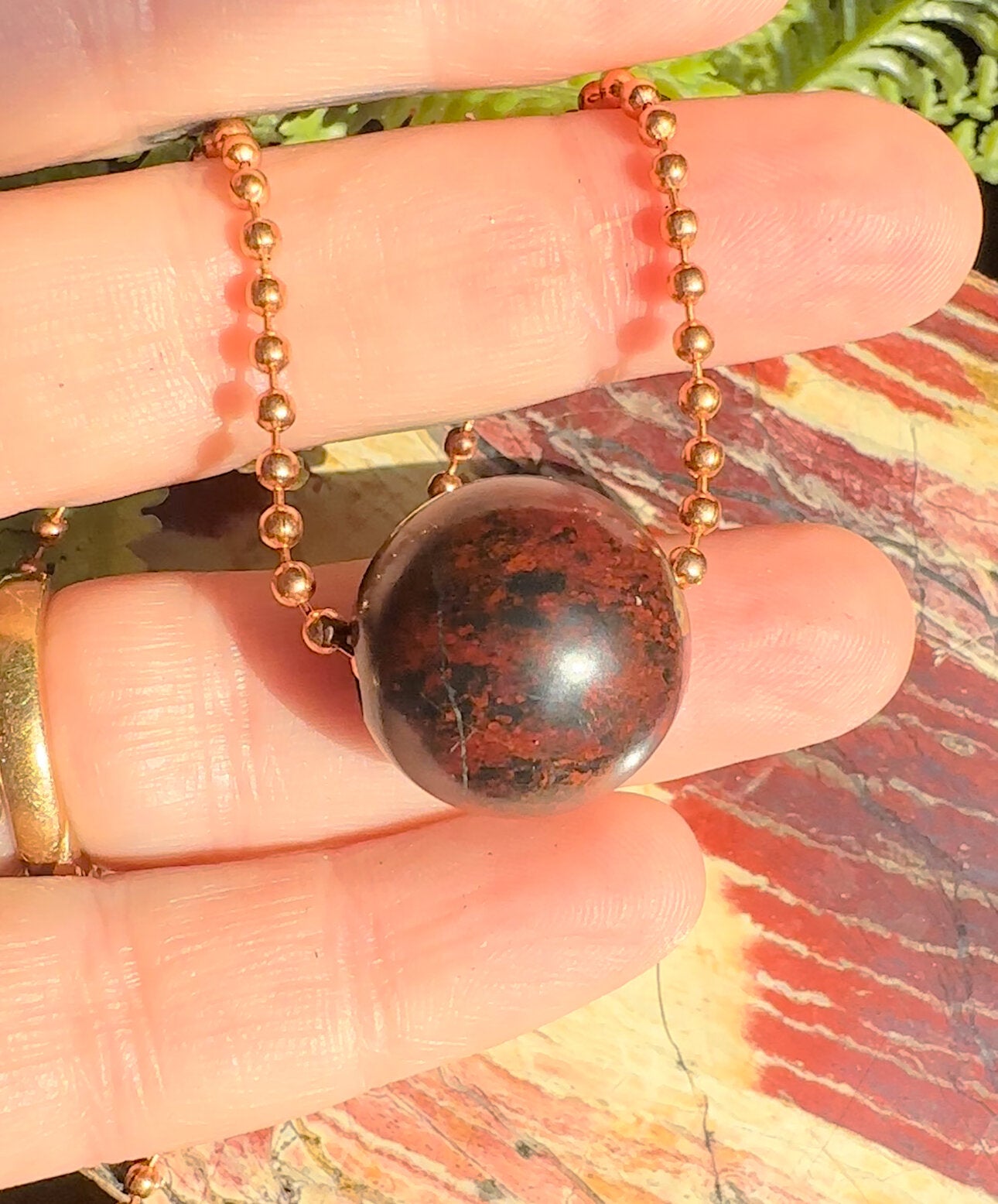 Lucialite Sphere on Solid copper.